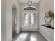 Bright entryway with double doors and tile flooring at 7506 Parkshore Dr, Apollo Beach, FL 33572