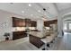 Modern kitchen with large island, granite countertops, and stainless steel appliances at 7506 Parkshore Dr, Apollo Beach, FL 33572