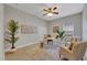 Spacious office with two armchairs, a work desk, and large art piece at 7506 Parkshore Dr, Apollo Beach, FL 33572