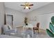 Bright office features a desk, two armchairs, and natural light at 7506 Parkshore Dr, Apollo Beach, FL 33572