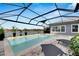 Relaxing screened pool with lake view at 7506 Parkshore Dr, Apollo Beach, FL 33572