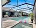 Large screened pool with spa and lounge area at 7506 Parkshore Dr, Apollo Beach, FL 33572