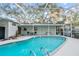 Relaxing pool area with screened enclosure at 7810 N 53Rd St, Tampa, FL 33617