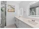 Elegant bathroom with double vanity, quartz countertops, and a glass shower at 8914 N Dexter Ave, Tampa, FL 33604