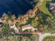 Aerial view of property showcasing the home's location on a large lot next to the lake at 905 Lake Fuller Dr, Lutz, FL 33548