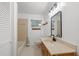 Clean bathroom featuring a vanity, bathtub, and mirror at 905 Lake Fuller Dr, Lutz, FL 33548