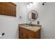 Updated bathroom with wood vanity, new lighting and fixtures at 905 Lake Fuller Dr, Lutz, FL 33548