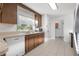 Bright kitchen features wood cabinets, stainless steel appliances, and tiled floors at 905 Lake Fuller Dr, Lutz, FL 33548