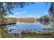 Serene lakefront property with dock; peaceful water views at 905 Lake Fuller Dr, Lutz, FL 33548