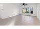 Bright living room with tile floors and lake view at 905 Lake Fuller Dr, Lutz, FL 33548