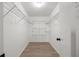 Large walk-in closet with wire shelving and wood-look floors at 905 Lake Fuller Dr, Lutz, FL 33548