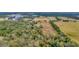 Wide shot of property showing the house and surrounding land at 9229 Fort King Rd Rd, Dade City, FL 33525