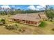 Aerial view showcasing a sprawling ranch-style home at 9229 Fort King Rd Rd, Dade City, FL 33525