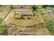 Aerial view of a ranch home on acreage with fenced pastures at 9229 Fort King Rd Rd, Dade City, FL 33525