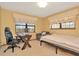 Bright bedroom with built-in workspace and comfortable bed at 9229 Fort King Rd Rd, Dade City, FL 33525