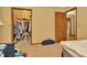 Well-lit bedroom with a large closet and carpet flooring at 9229 Fort King Rd Rd, Dade City, FL 33525