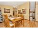 Spacious dining area with hardwood floors and a large wooden table at 9229 Fort King Rd Rd, Dade City, FL 33525
