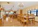 Bright dining room with hardwood floors, chandelier, and wooden table at 9229 Fort King Rd Rd, Dade City, FL 33525