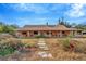 Brick ranch house with long covered porch and stone walkway at 9229 Fort King Rd Rd, Dade City, FL 33525