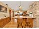 Open kitchen with island, hardwood floors and wooden cabinetry at 9229 Fort King Rd Rd, Dade City, FL 33525