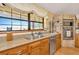 Kitchen boasts wood cabinets, granite countertops, and a built-in oven at 9229 Fort King Rd Rd, Dade City, FL 33525