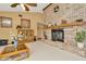 Living room features a brick fireplace and hardwood floors at 9229 Fort King Rd Rd, Dade City, FL 33525