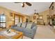 Open living room with a fireplace and plenty of seating at 9229 Fort King Rd Rd, Dade City, FL 33525