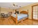 Spacious main bedroom with hardwood floors and private access at 9229 Fort King Rd Rd, Dade City, FL 33525