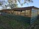 Green pole barn structure in rural setting with wood framing and metal siding at 9229 Fort King Rd Rd, Dade City, FL 33525