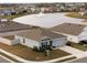 Aerial view of home near lake in community at 10303 Charlotte Dr, Parrish, FL 34219