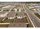 Aerial view of a new home community with lake and surrounding houses at 10303 Charlotte Dr, Parrish, FL 34219