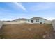 Spacious backyard with home view and fence at 10303 Charlotte Dr, Parrish, FL 34219