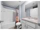 Clean bathroom with a shower/tub combo and white vanity at 10303 Charlotte Dr, Parrish, FL 34219