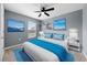 Bedroom with a king-size bed, window, and ceiling fan at 10303 Charlotte Dr, Parrish, FL 34219