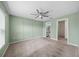 Spacious bedroom with green walls and carpeted floors at 10303 Charlotte Dr, Parrish, FL 34219
