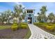 Community clubhouse entrance with a charming walkway and landscaping at 10303 Charlotte Dr, Parrish, FL 34219