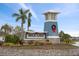 Community entrance sign for Bella Lago, featuring a charming lighthouse-style structure at 10303 Charlotte Dr, Parrish, FL 34219