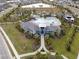 Resort-style community pool with a clubhouse and surrounding landscaping at 10303 Charlotte Dr, Parrish, FL 34219