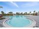 Expansive kidney-shaped community pool with plenty of deck space at 10303 Charlotte Dr, Parrish, FL 34219