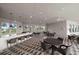 Outdoor covered patio with seating and a bar at 10303 Charlotte Dr, Parrish, FL 34219