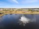 Aerial view of community with lake and fountain at 10303 Charlotte Dr, Parrish, FL 34219