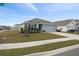 House exterior showcasing a two-car garage and well-maintained lawn at 10303 Charlotte Dr, Parrish, FL 34219