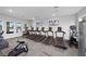 Modern gym featuring treadmills, ellipticals, and strength training machines at 10303 Charlotte Dr, Parrish, FL 34219