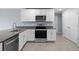 Modern kitchen with stainless steel appliances and granite countertops at 10303 Charlotte Dr, Parrish, FL 34219