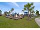 Community playground with multiple playsets and shaded areas at 10303 Charlotte Dr, Parrish, FL 34219