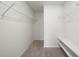 Large walk-in closet with wire shelving and a bench at 10303 Charlotte Dr, Parrish, FL 34219