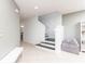 Modern staircase with simple, clean lines, leading to the upper level at 11301 Hudson Hills Ln, Riverview, FL 33579