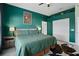 Large bedroom with dark green walls and king-size bed at 11317 Coconut Island Dr, Riverview, FL 33569