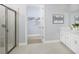 Main bathroom with double vanity, walk-in shower, and a separate closet at 12348 49Th E St, Parrish, FL 34219