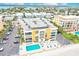 Aerial view of building, pool, parking, and beach at 16308 Gulf Blvd # 303, Redington Beach, FL 33708